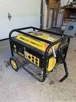 Front left angle showing generator frame, wheels, control panel and fuel tank