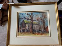 Front of framed oil painting showing full composition, mat and gold frame