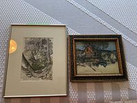 Overview of both framed watercolour paintings on white surface