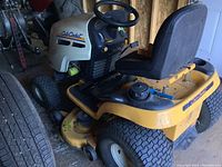 Side view of entire mower showing deck, chassis and operator area