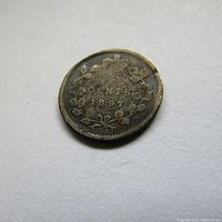 Reverse side of the coin showing denomination 5 CENTS and year 1897 inside a wreath.