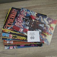 Stack of comic books with visible covers including Cybernary and Deathblow