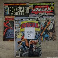 Photo showing all three comics spread out on a floor: The Frankenstein Monster #8, The Tomb of Dracula #59, and Marvel Classics Comics #52 Dracula.