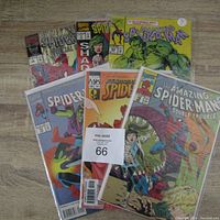 Full view of all six comics bagged and boarded with various Spider-Man related covers.