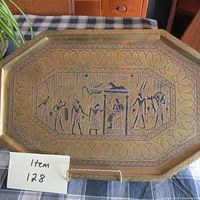 Top view of the brass platter with Egyptian engravings and decorative border, showing full design and dimensions.
