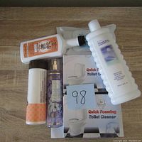 Lot displayed with Dr. Bronner's Peppermint Castile Soap, floral body mist, orange rolled item, and two Quick Foaming Toilet Cleaner refill boxes.