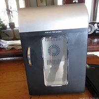Front view of Mind Reader mini fridge showing door with clear window and silver handle