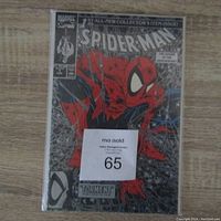 Front view of Spider-Man #1 comic with silver cover, showing the character prominently and the collector's item text.