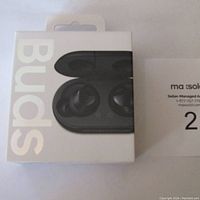 Front packaging showing 'Buds' text and image of black wireless earbuds with charging case.