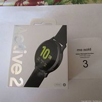 Front of the unopened box with image of Samsung Galaxy Watch Active 2 and size indication 44mm