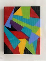 Front view of colorful geometric abstract acrylic painting by Nancy Gold with plexiglass cover.
