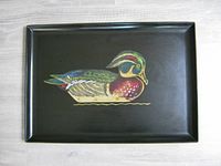 Top view of the rectangular black tray with a colorful wood duck design in the center.