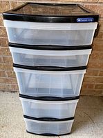Full front view of the Gracious Living 5 drawer plastic storage unit showing all drawers and overall shape.
