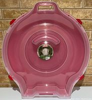 Front view of empty Sterlite wreath storage container showing shape, lid, and handle.