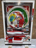 Full front view of the pachinko machine showing overall design and condition