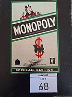 Photo of the full Monopoly Popular Edition game board from 1946 showing Mr. Monopoly character, large dollar sign with train, and branding labels including Parker Brothers and The Copp Clark Co.