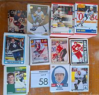 Partial view of hockey cards from various sets including Topps, Score, and Upper Deck with recognizable players such as Tom Kurvers and Theoren Fleury