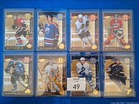 Full view of 8 rookie hockey cards from 2005/06 Upper Deck Power Play set in protective sleeves.
