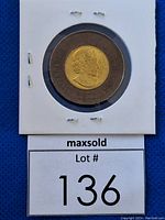 Obverse side of the 2022 Black Toonie showing Queen Elizabeth II with date 2022.