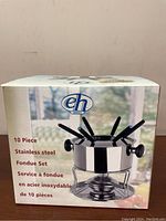 Box exterior showing brand and product details of the 10 piece stainless steel fondue set