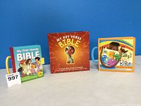 Front view of three children's Bible board books with colorful covers and handles.