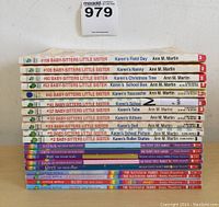 Photo showing 11 Babysitters Little Sister books arranged horizontally with titles visible on spines.