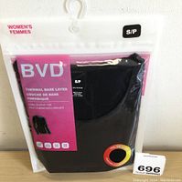Front view of new packaged BVD Women's thermal base layer long sleeve top in black, size small, in sealed plastic packaging with hanger.