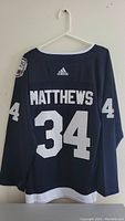 Rear view of the dark navy blue Adidas jersey with 'MATTHEWS' and number '34' printed in white.