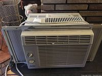 Front view of Danby window air conditioner showing vents, control knobs, and side panels.