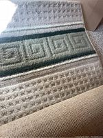 Full view of the rug showing central geometric pattern and textured stripes