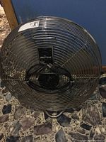 Front view of large Patton industrial fan showing metal cage and blades.