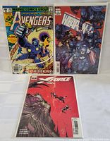 Photo of three Marvel comic books: Avengers #184, Weapon X #1, and X-Force #1 arranged on white background.