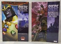 Two Marvel graphic novels standing side by side, cover art shows Thanos and Thor.