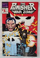 Front cover of The Punisher War Zone #1, showing the main character with guns firing and bullet casings.