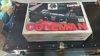 Coleman stove original box on black carrying case