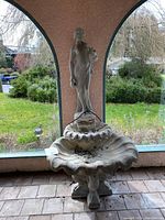 Full view of fountain showing basins, statue, and base