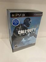 Front of sealed Call of Duty Ghosts Collector's Edition box for PS3 showing artwork and PlayStation branding.