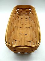 Top view showing interior weave pattern and natural light maple wood tone of the rectangular Longaberger basket.