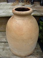 Front angled view of antique ironstone crock showing shape, texture and color.