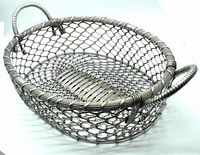 Top and side view showing circular woven wire mesh construction and wrapped tubular handles of the large burnished aluminum metal basket.