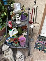 Full view of metal garden cart with mini pots, plants, and elf sculptures showing arrangement and contents