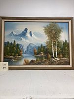 Frontal view of the full framed landscape painting depicting a mountainous canyon with waterfall, trees, and cabin, showing the entire artwork.