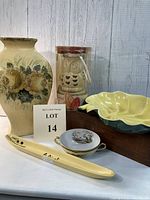 Wide view showing all five items: yellow vase with floral motif, owl votive candle, yellow leaf dish, Nippon two-handle dish, and yellow olive tray.