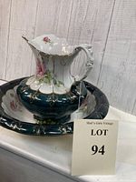 Photo of Victorian ceramic pitcher and bowl showing dark green trim, pink rose design, and gold accents