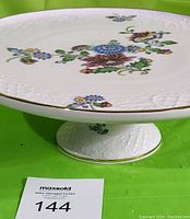 Side view of Schumann Auzberg Bavaria pedestal cake plate showing floral design and pedestal base with embossed details and gold rim.