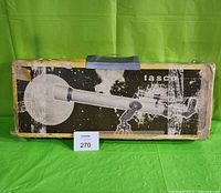 Original Tasco telescope box with graphic showing the telescope and space theme, box shows significant wear.
