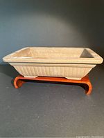 Photo showing the top-down perspective of the rectangular terra cotta bonsai planter on a wooden curved stand.