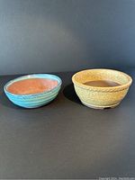 Front view of two glazed bonsai planters showing exterior colors and surface texture, blue and yellow-beige.