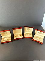 Overview photo showing four open cases containing Donald J. Trump Signature Collection cufflinks and tie clips.
