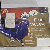 Original product box showing the product name, features, images of the dog wash station, and assembly dimensions.